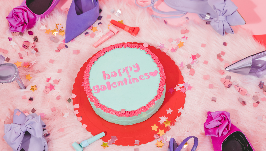 a picture of a cake with the words Galentine’s Day on it in icing
