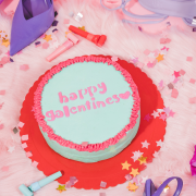 a picture of a cake with the words Galentine’s Day on it in icing