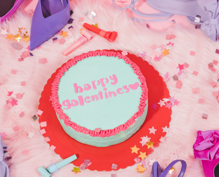 a picture of a cake with the words Galentine’s Day on it in icing